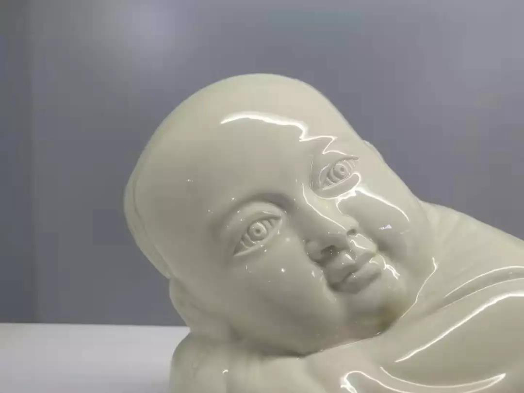 大宋定窯設(shè)計的孩兒枕的局部 大宋定窯設(shè)計的孩兒枕的局部